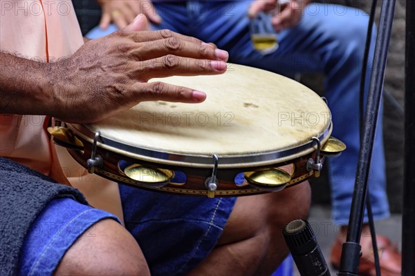 Tambourine being played by a ritimist during a samba performance in Rio de Janeiro