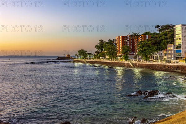 Seafront in the tourist region of the city of Salvador in Bahia during sunset with the sea