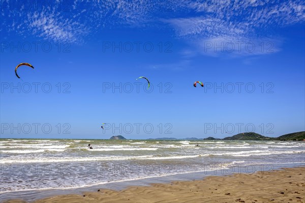 Kitesurfers enjoying the wind and waves of Rasa beach in Buzios in the state of Rio de Janeiro