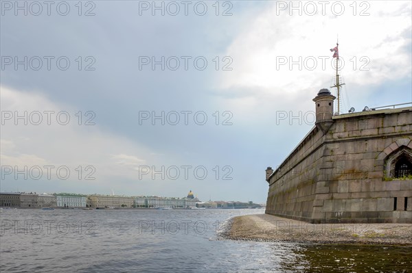 Saint Petersburg city seen from inside the old and historic Saint Peter fortress with the Neva river in the foreground