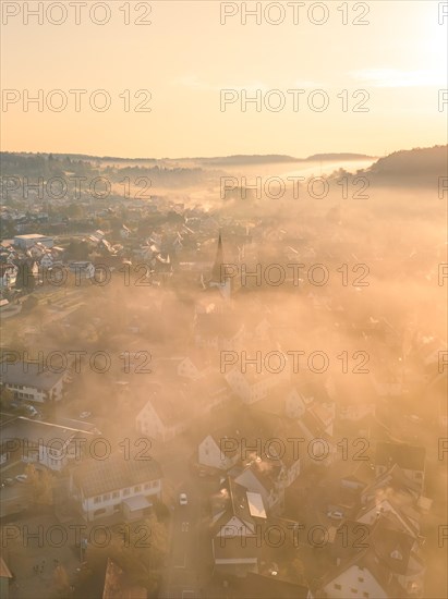 City in the fog at sunrise