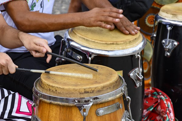 Percussion instrument called atabaque being played in traditional Brazilian samba party