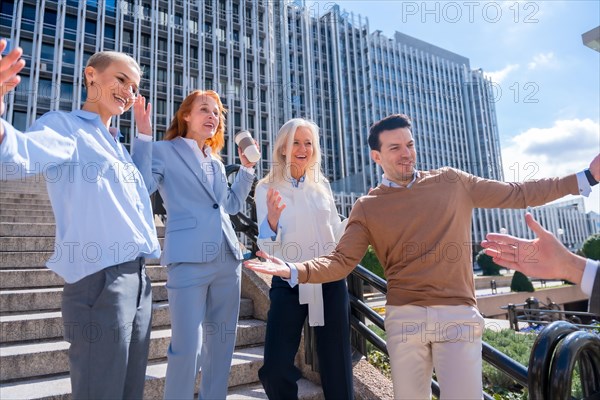 Greeting each other coworker. Group of executives or business people outdoors in a corporate office area