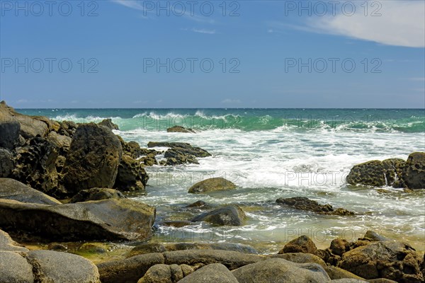 Rocky beach and its waves on the coast of the city of Salvador in Bahia in the northeast region of Brazil