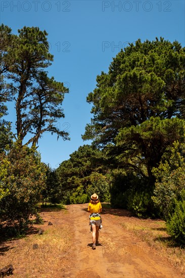 A mother with her son holding her son in her arms on the La Llania hiking trail in El Hierro