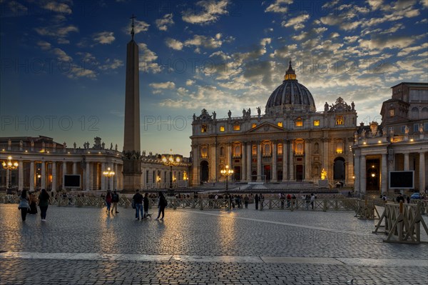 People in front of St. Peter's Basilica in the evening light