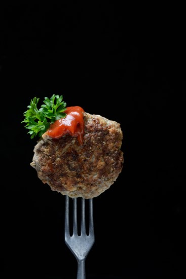 Homemade meatball on fork