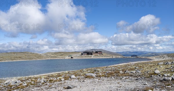 Snoheim mountain hut by a mountain lake