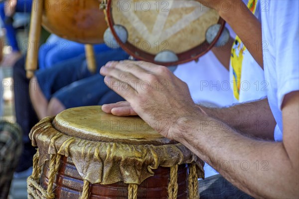 Rustic percussion instrument called atabaque and used in capoeira and Brazilian samba performances