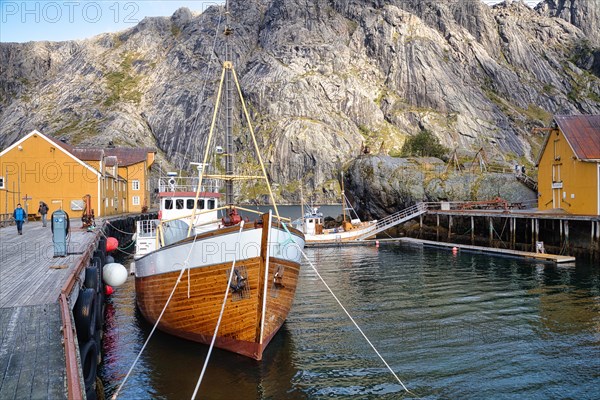 Historic buildings and fishing boats in Nusfjord harbour