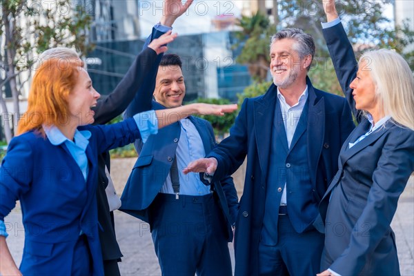 Senior Executives with Positive Attitude High-Five to Mark Achievement and Progress