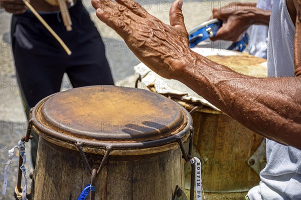 Musicians playing traditional instruments used in capoeira