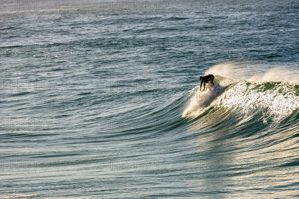 Surfer silhouette on Ipanema beach