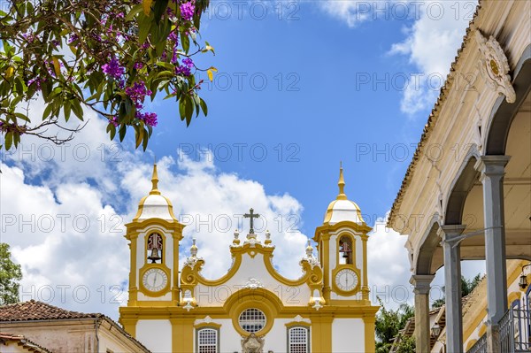 Historic baroque church tower with bell and clock in the old city of Tiradentes in Minas Gerais state