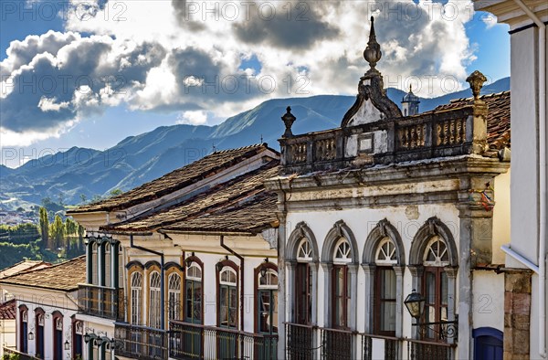 Facade of old houses built in colonial architecture with their balconies