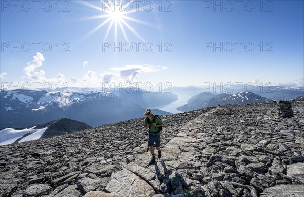 Hikers climbing to the top of Skala