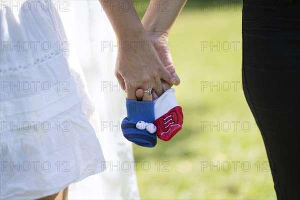 A couple of women getting married outdoors