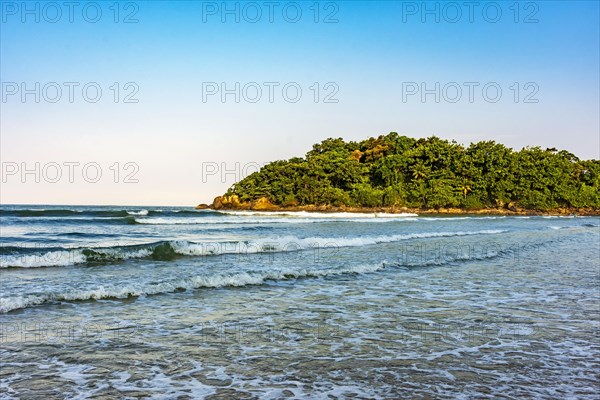 Peaceful and idyllic beach with the rainforest and the sea in Bertioga on the nort coast of the state of Sao Paulo