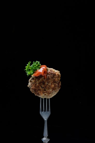 Homemade meatball on fork