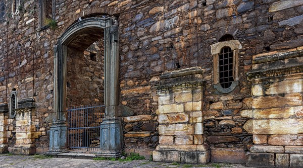 Strong stone walls of unfinished historic colonial church in ruins in the city of Sabara in Minas Gerais