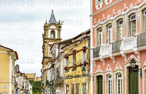 Old houses and church tower deteriorated by time in the historic district of Pelourinho in the city of Salvador in Bahia