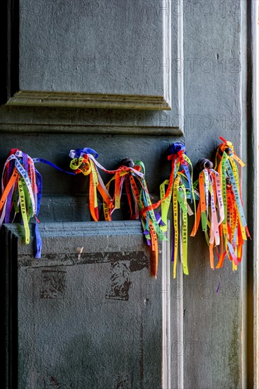 Famous colorful ribbons of good luck from Our Lord of Bonfim tied to the door of the church in Salvador