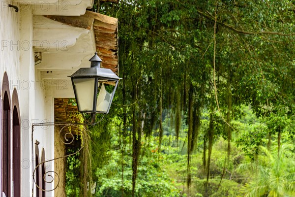 Colonial style house facades with old metal lantern in the historic town of Paraty