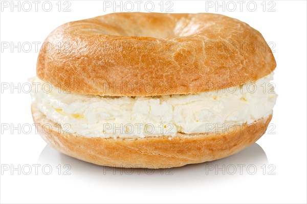 Bagel roll topped with cream cheese sandwich for breakfast silhouetted against a white background in Stuttgart