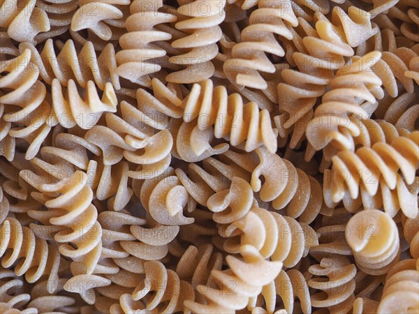 Fusilli Italian pasta background