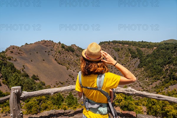 A young tourist at the viewpoint of the Fireba volcano in La Llania park in El Hierro