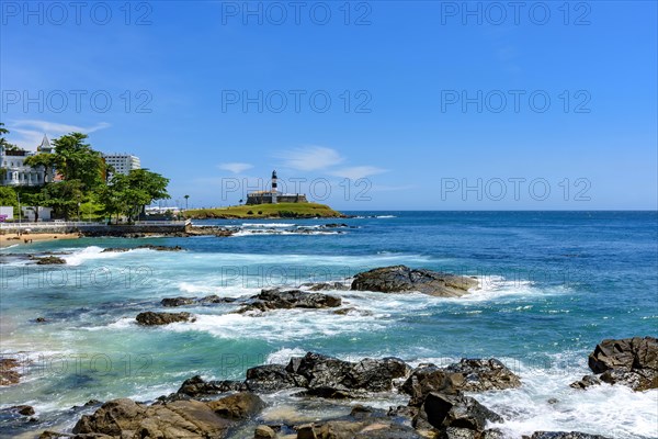 The sea of the city of Salvador in Bahia and the famous Barra lighthouse in a sunny day