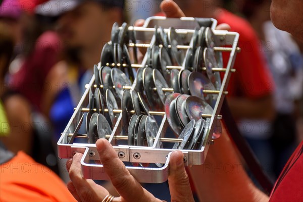 Metal rattle during street carnival festivities in Brazil