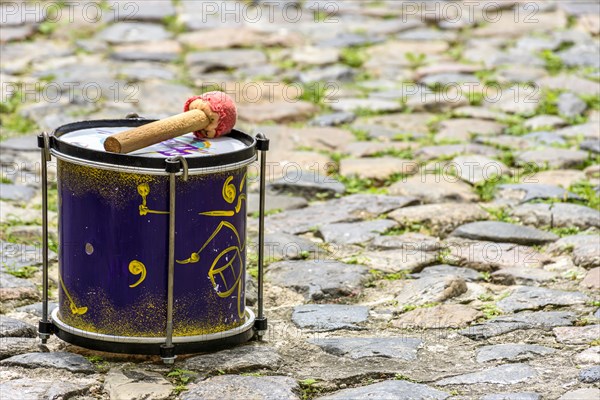 Small drum decorated on the cobblestones of the Pelourinho slopes in Salvador