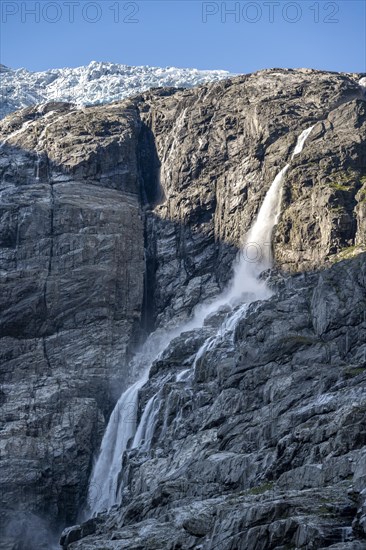 Waterfall at the glacier tongue Kjenndalsbreen