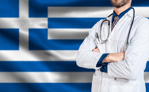 Doctor arms crossed with stethoscope over greece flag. Health and care with flag of greece