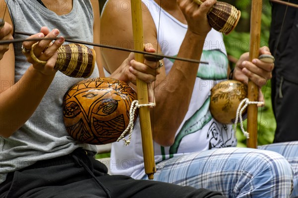 Afro Brazilian percussion musical instruments during a capoeira performance in the streets of Brazil
