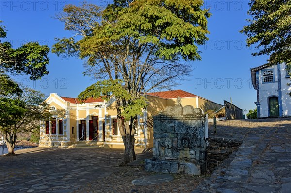 Neoclassical construction in an old historic square with a drinking fountain from the time of the empire in the city of Diamantina in Minas Gerais