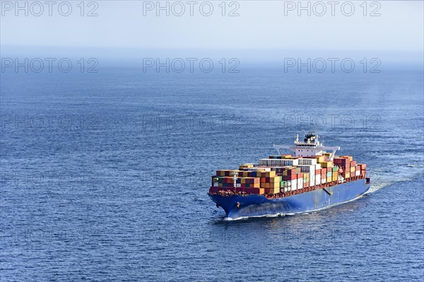 Cargo ship carrying several containers on the waters of the sea of rio de Janeiro