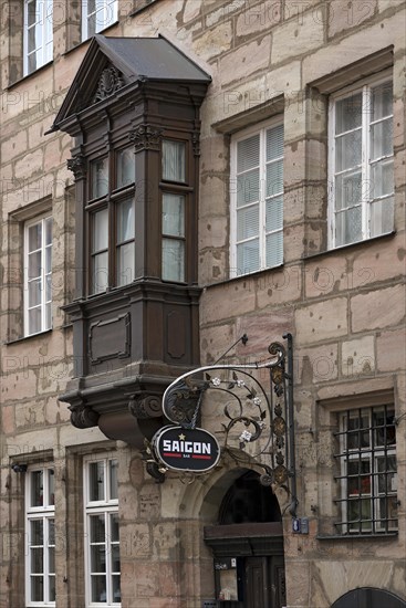 Historic nose sign with choerlein on a former inn