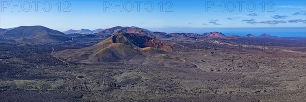Panorama from the crater rim of Caldera Blanca to the fire mountains in Parque National de Timanfaya