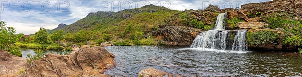 Waterfall and lakes with mountains in background on Biribiri environmental reserve on Diamantina