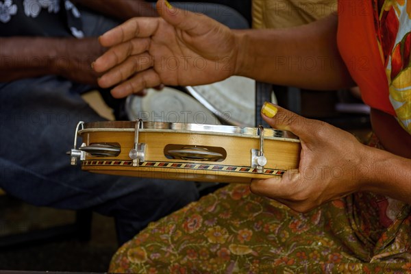 Tambourine being played by a ritimist during a samba performance in brazilian carnival in Rio de Janeiro