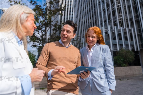 Group executives or businessmen and businesswoman in a business area. During a break from work