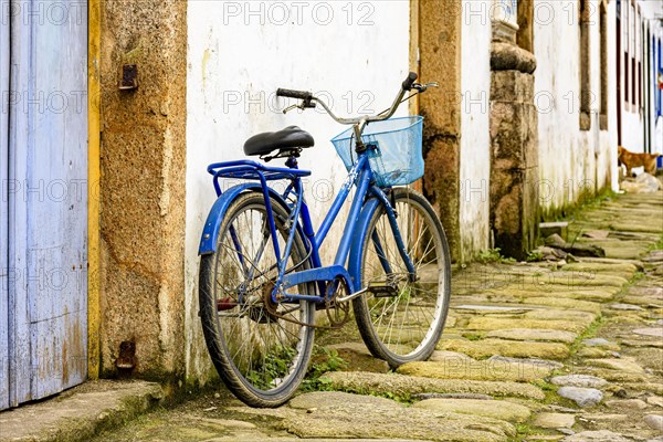 Bike in the old cobblestone streets of the city of Paraty with its historic colonial-style houses.