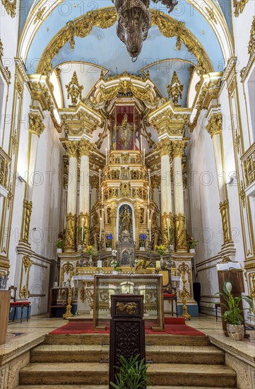 Golden altar inside the historic and famous church of Our Lord of Bomfim in Salvador