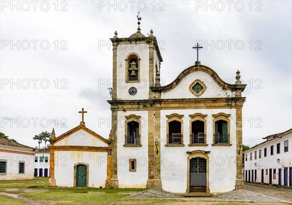 Church facade and colonial style house in the famous city of Paraty on the coast of Rio de Janeiro