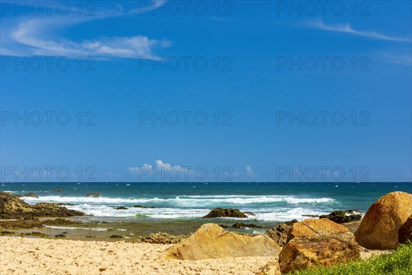 Small stretch of the beautiful Itapua beach in Salvador with its reefs and sand surrounded by the tropical sea