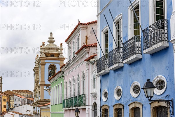 Facades of old colorful colonial style houses and churches in the historic district of Pelourinho in the city of Salvador in Bahia