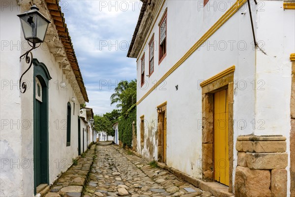 Traditional street in the historic city of Paraty in the state of Rio de Janeiro with cobblestone pavement and colonial style houses