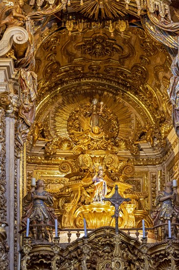 Interior and altar of historic church all painted in gold with baroque architecture in the old city of Tiradentes in Minas Gerais state